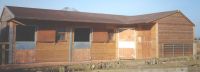 3 Loose Boxes and a Corner Unit. Featuring a brown Felt Tile Roof.