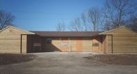 2 Loose Boxes, 2 Corner Units, 1 Covered Walkway, and 2 Tack Rooms. Featuring Brown Felt Tile Roof. 