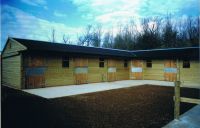 L-shaped stable yard with 6 loose boxes and a corner unit. 