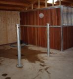 Showing side of full timber partition and stall posts in wash box area. 