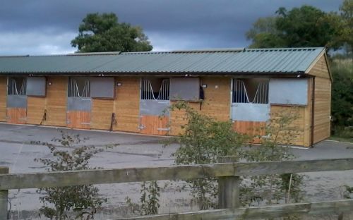 Warwick Buildings Stables featuring a Metal Profile Roof, with lining to reduce noise and condensation sometimes associated with this otherwise durable roofing material